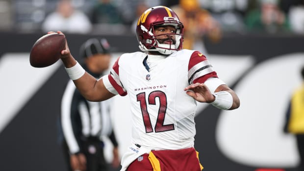 Washington Commanders quarterback Jacoby Brissett (12) throws the ball during the second half against the New York Jets at MetLife Stadium.